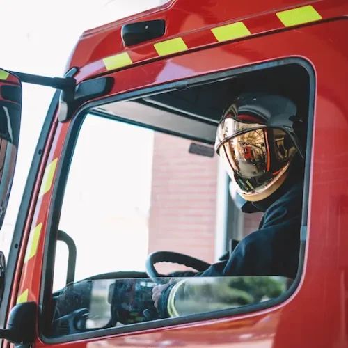firemen-driving-inside-an-emergency-vehicle-2025-04-03-15-19-43-utc
